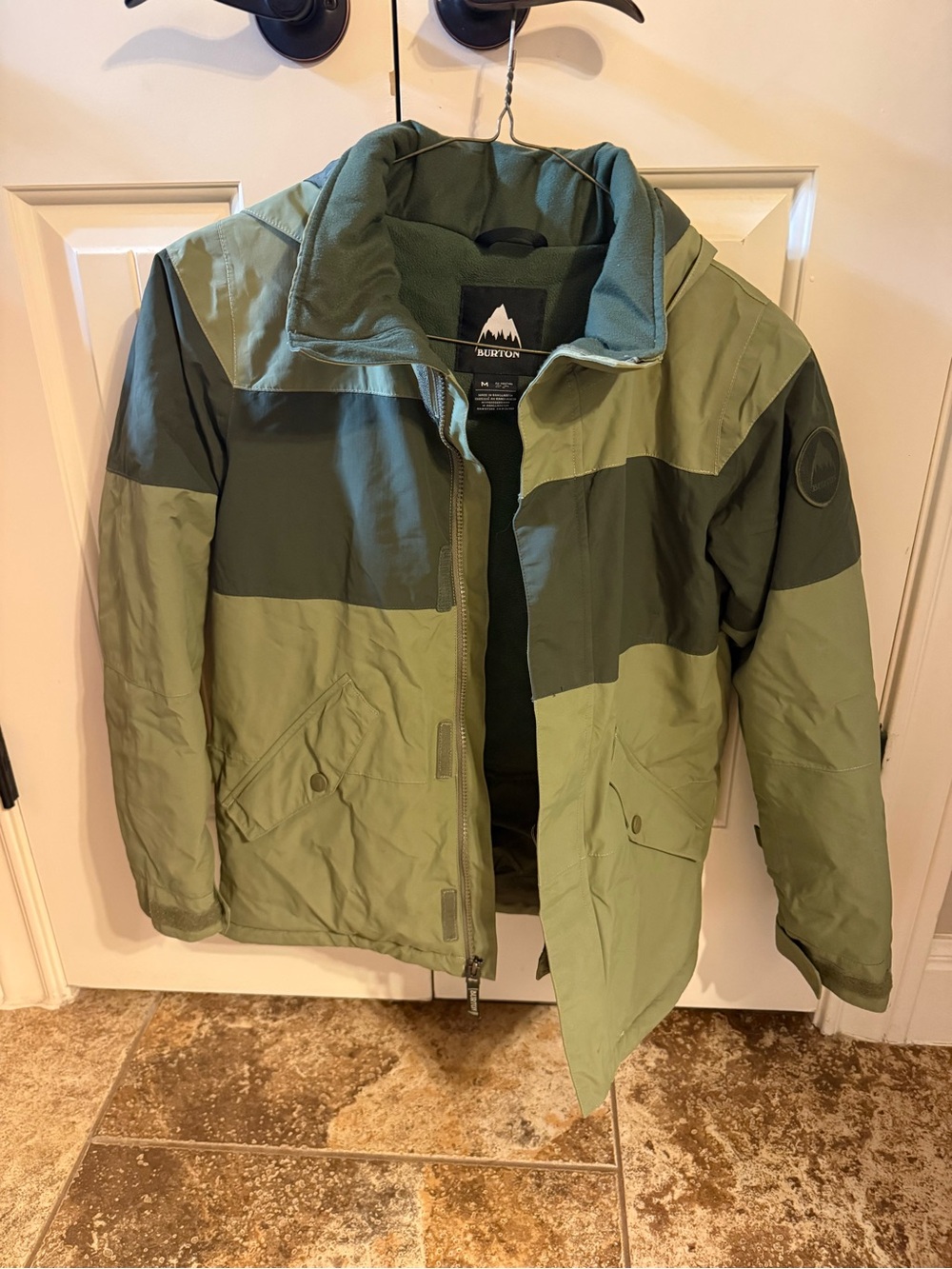 Burton Kids Symbol Snowboard Jacket in the color Martini Olive. Size M like new